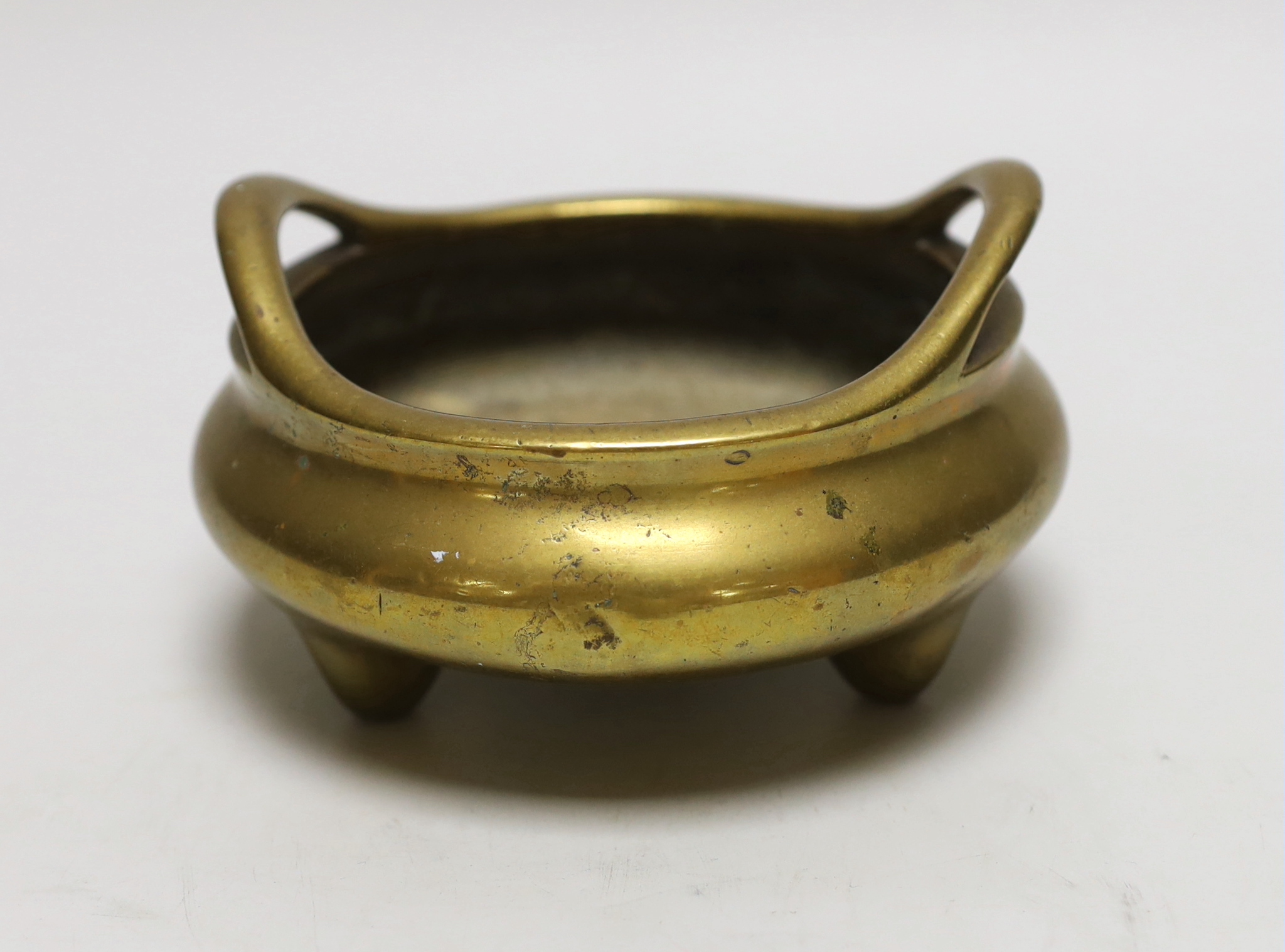 A Chinese bronze tripod censer, ding, Xuande mark but 19th century, 13cm wide